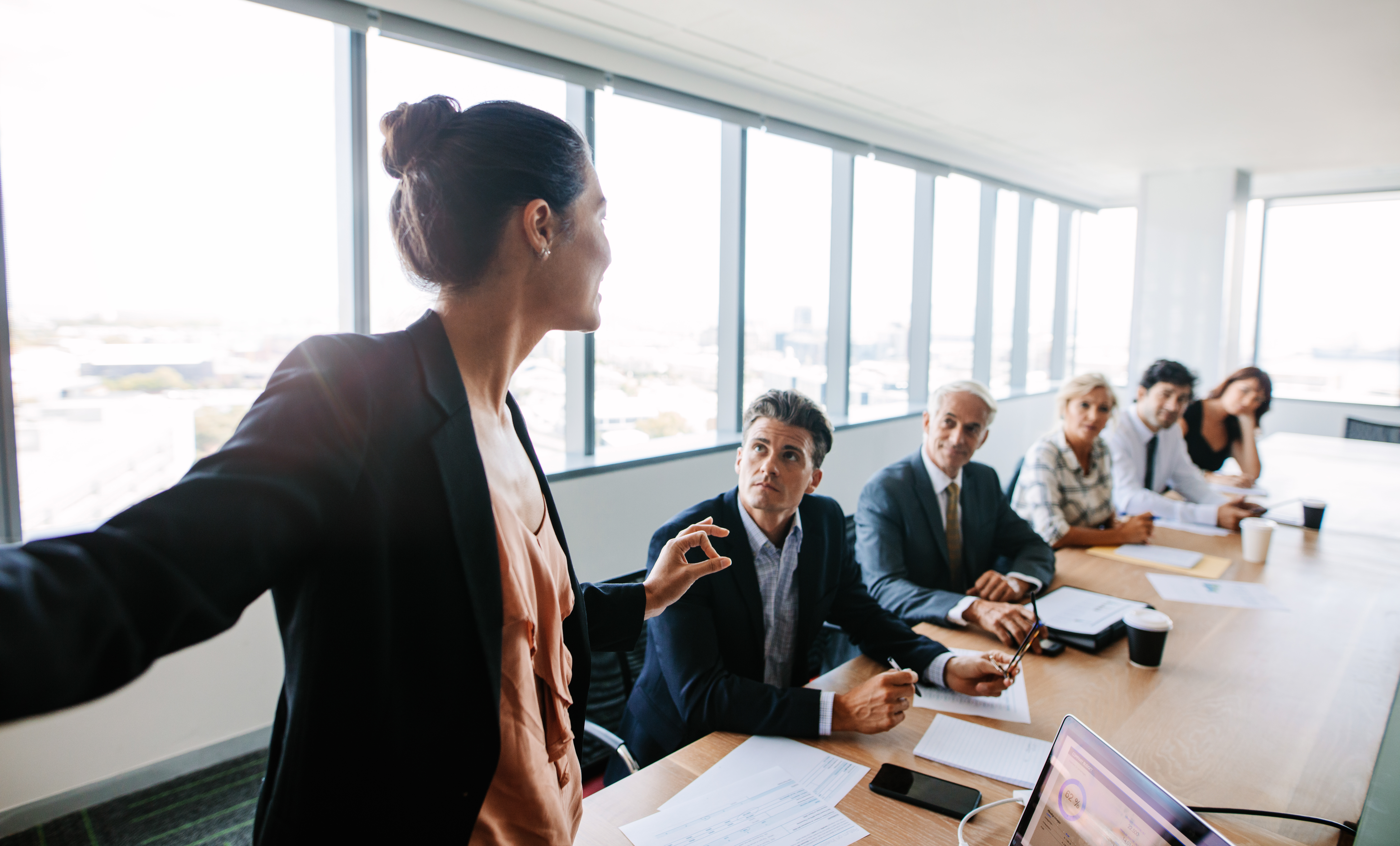 Businesswoman giving presentation to coworkers