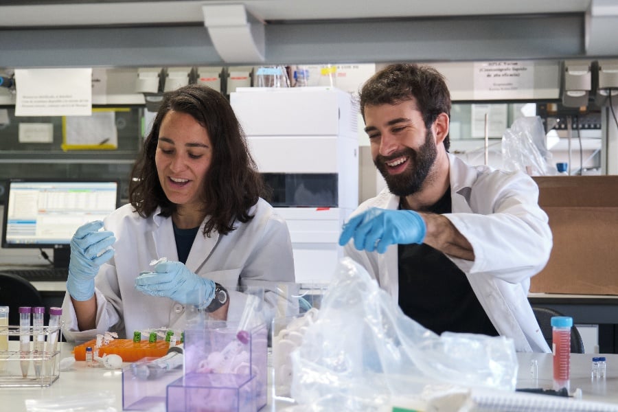 a man and a woman in a medical laboratory 