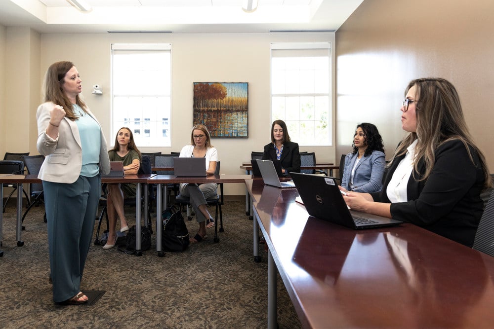 group of higher education students collaborating in a smu simmons classroom